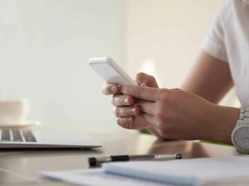 Businesswoman looking important contact on phone