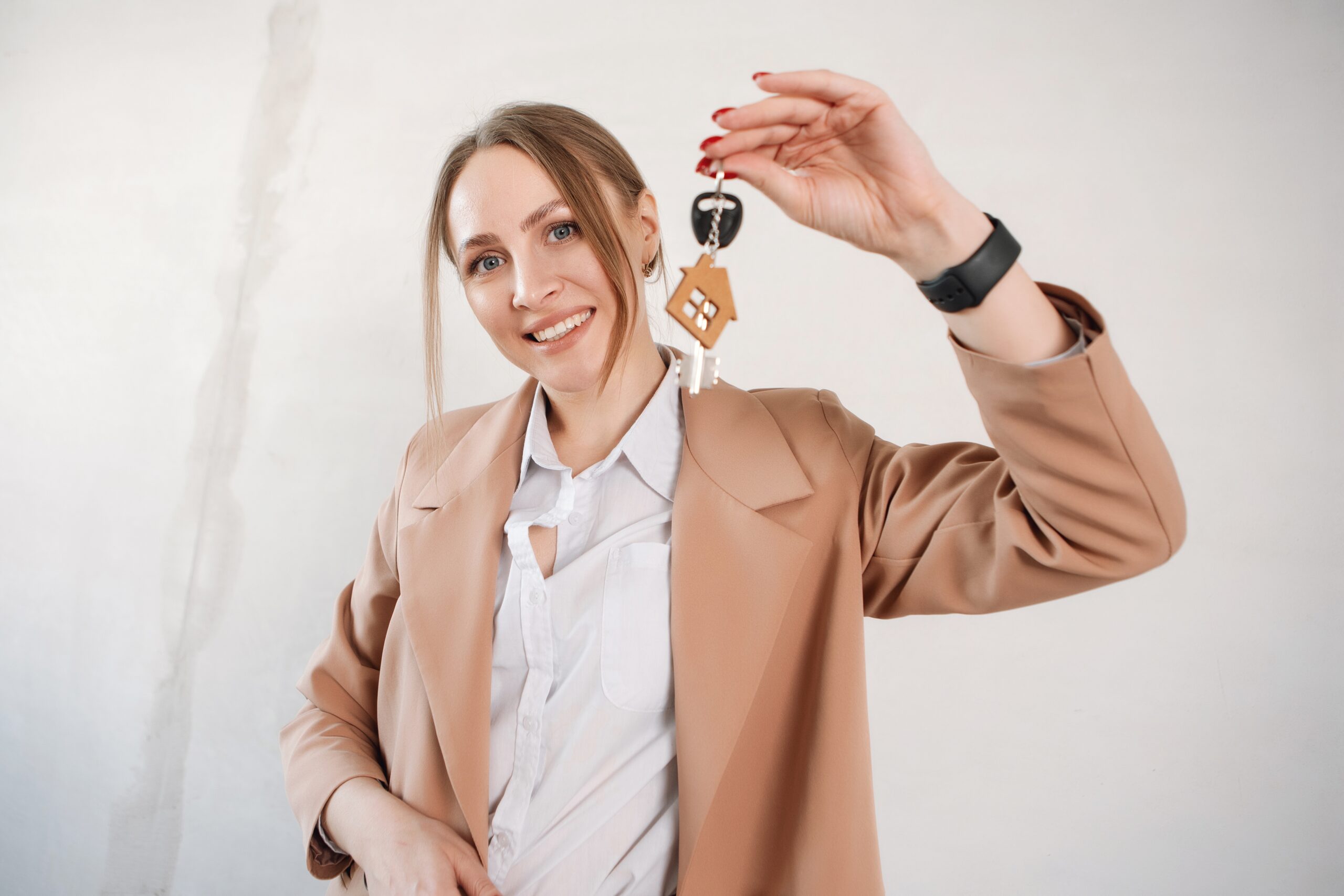 woman-hold-keys-with-house-keychain-real-estate-a-2024-10-31-22-58-50-utc